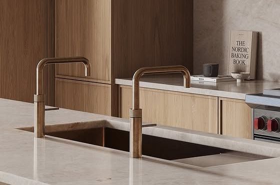 Brass taps over the island sink