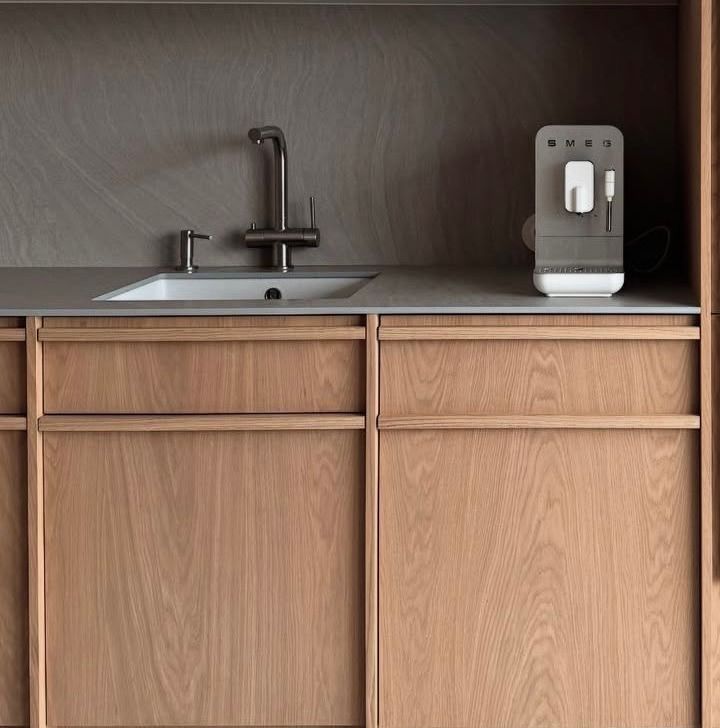 Sink run with oak drawer fronts