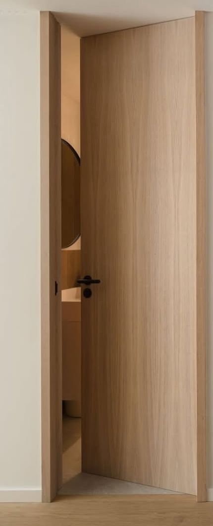 Oak door opening into the bathroom