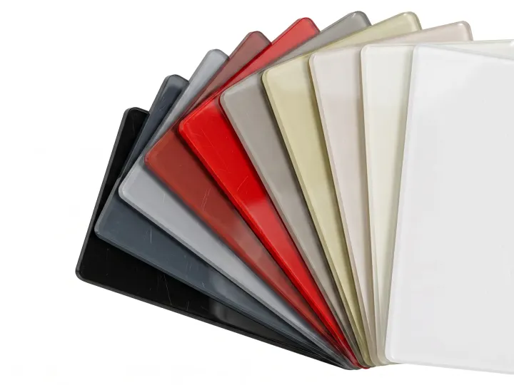 High-gloss acrylic cabinet front samples in white, grey and red