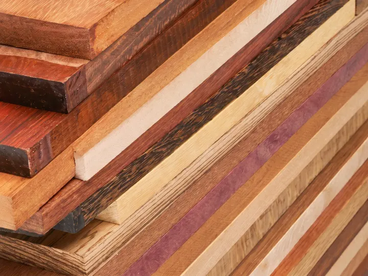 Solid hardwood boards in several species stacked together