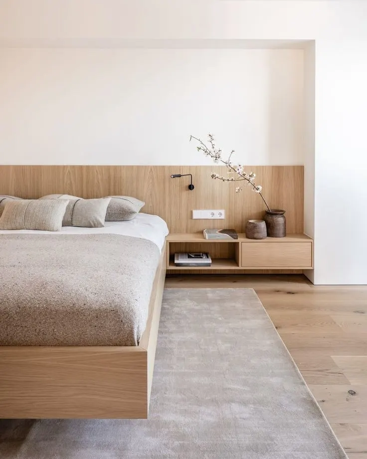 Custom bedroom with an oak headboard wall and floating nightstands