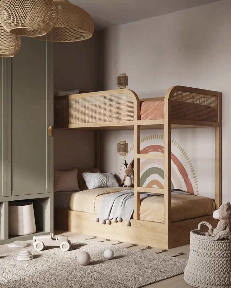 Oak bunk bed with cane guard rails beside a sage green wardrobe, toys on a rug and a rainbow mural on the wall