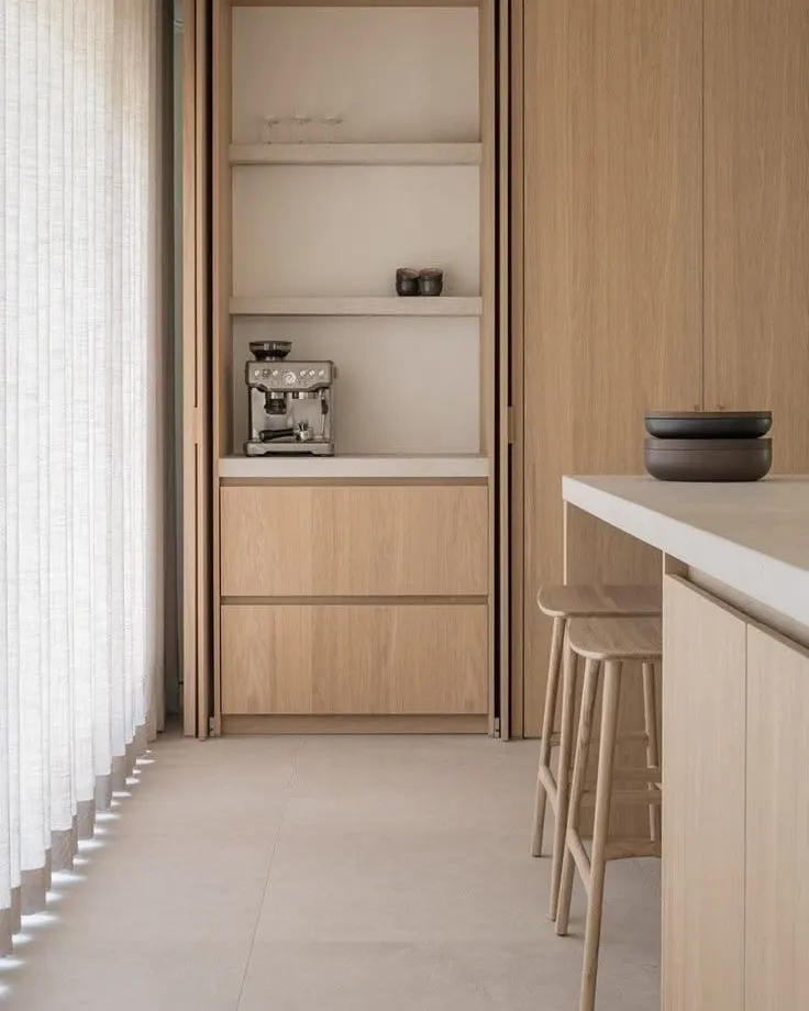 Custom kitchen with oak fronts and a white island, built to measure in Tirana
